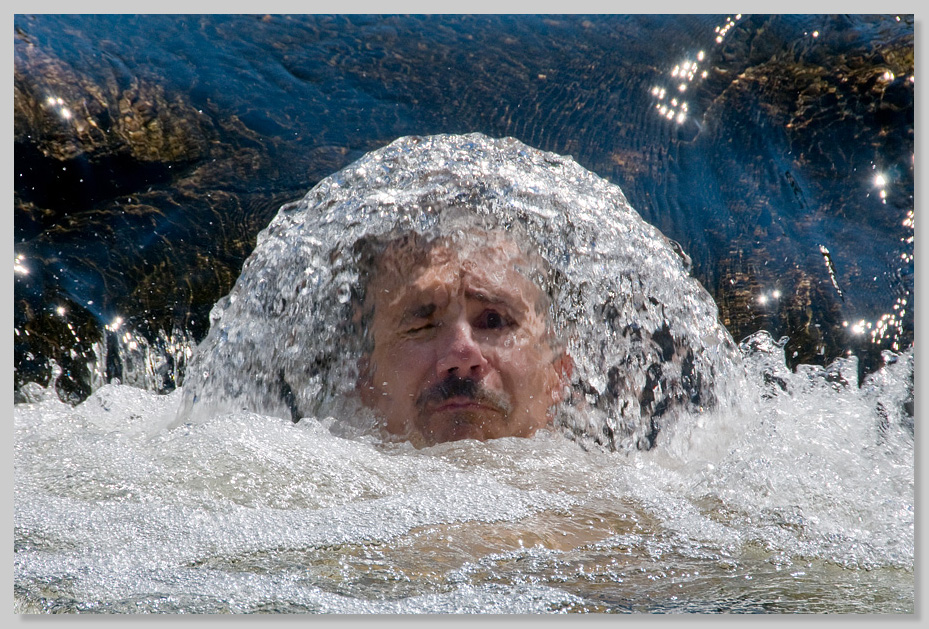 Man's face in waterfall